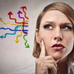 Thoughtful woman with colorful arrows representing choices and decisions