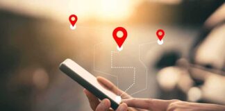 Person using a smartphone with location markers displayed on the screen