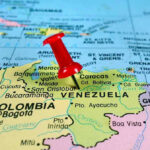 Trump’s Daring Move: Maduro Captured! Red pin on Venezuela, South America map.