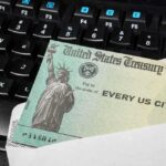 A US Treasury check placed on a black keyboard