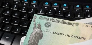 A US Treasury check placed on a black keyboard