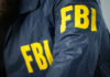 FBI jacket with yellow letters.