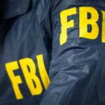 FBI jacket with yellow letters.