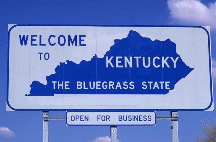 Welcome sign for Kentucky, the Bluegrass State, with a blue background
