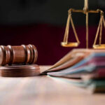 Government Insider BUSTED Destroying Critical COVID Records Judges gavel, scales of justice, and legal documents.