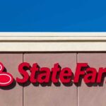 State Farm logo displayed on a building against a blue sky