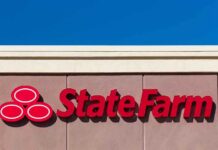 State Farm logo displayed on a building against a blue sky