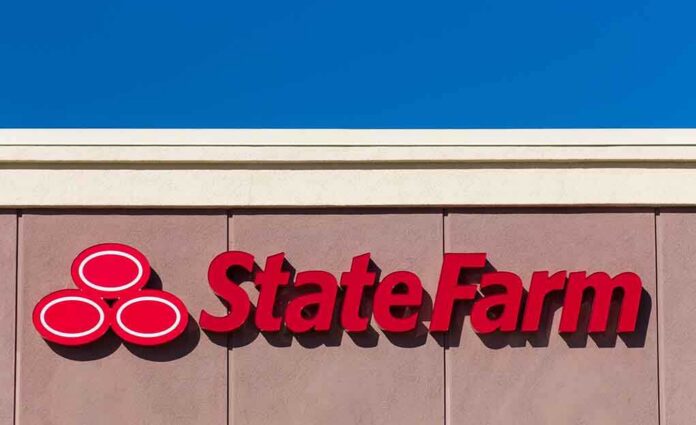 State Farm logo displayed on a building against a blue sky