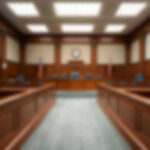 NYC’s Jail Reforms: Are Dangerous Criminals Walking Free? Empty courthouse courtroom with wooden benches and chairs.