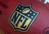 Quarterback’s Trump Moment Sparks Locker Room Drama Close-up of an NFL football with the logo prominently displayed