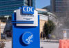 War-Zone Biolabs Under U.S. Microscope Sign for CDC Edward R. Roybal Campus.