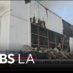 Smoke continues to grow Sunday morning from the Boyle Heights warehouse fire