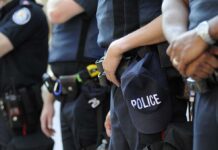 Court Dropkicks Stop‑And‑Frisk Presumption Group of police officers in uniform standing together with a police cap visible