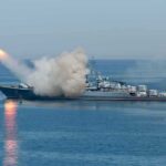 A military ship launching a missile into the ocean
