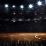 Basketball court under bright arena lights