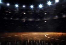 Basketball court under bright arena lights