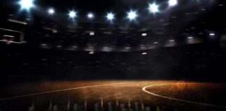Basketball court under bright arena lights