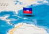 Haiti flag pin on a map of the Caribbean