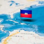 Haiti flag pin on a map of the Caribbean