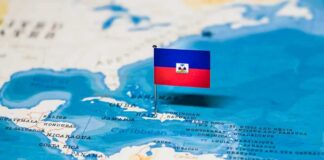 Haiti flag pin on a map of the Caribbean