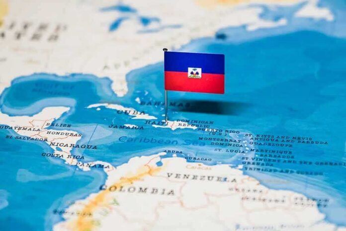 Haiti flag pin on a map of the Caribbean