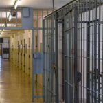 Humanitarian Twist: Marine’s Sudden Russian Release Prison corridor with barred doors