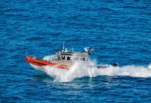 coast guard patrol boat speeding across open ocean