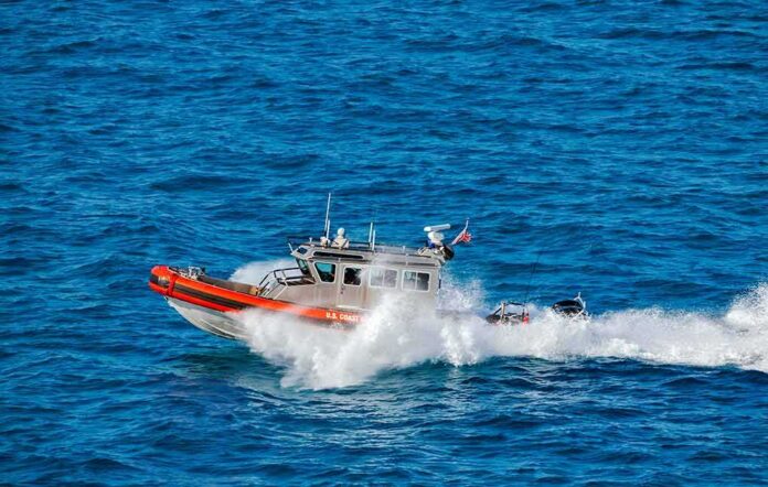 shutterstock_1140667874 coast guard patrol boat speeding across open ocean